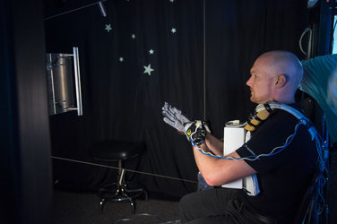 Alexander Gerst prepares to use virtual reality hardware 