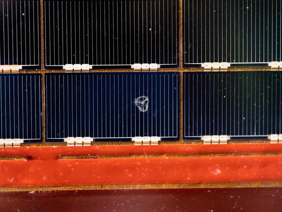 Meteorite damage on a returned Hubble solar panel